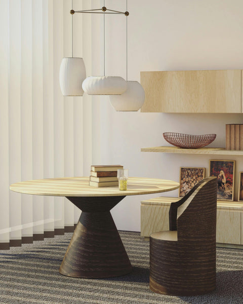 Una sala de estar contemporánea que presenta un diseño elegante y minimalista. El punto focal es un sofá lujoso y mullido que invita al relax, complementado con lámparas de mesa elegantes que proporcionan una luz ambiental cálida.