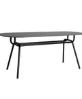 Mesa de comedor Tamasi con tablero de piedra negra mate y estructura de hierro, diseño sofisticado y robusto para hasta 8 comensales.
