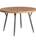 Mesa de comedor redonda en madera de abeto con patas metálicas, ideal para espacios acogedores.